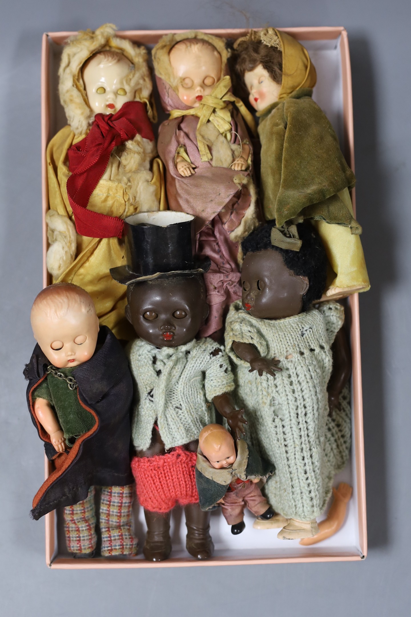 Seven 1940's small dolls